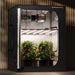 Spider Farmer G8600 800W Smart LED Grow Light – High-Intensity 5x5 Coverage Spider Farmer indoor grow tent with plants inside, on a wooden floor.