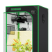 Vivosun 2x2 Smart Grow Tent Kit – 100W LumaLight & GrowHub E42A+ with a black exterior, bright green trim, and a clear front door showing a plant growing inside. The tent features a digital temperature and humidity control panel on the top right.