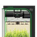 Vivosun 4x4 Smart Grow Tent Kit – 500W LumaLight & GrowHub E42A+ indoor garden kit with a black grow tent, green trim, hanging grow light, exhaust fan, and growing plants inside.