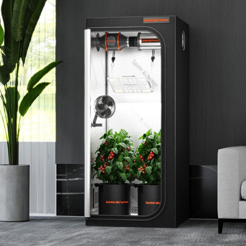 Spider Farmer® 2.3’x2.3’x5.2′ Grow Tent Garden pod with plants inside, placed indoors next to a plant and a chair.