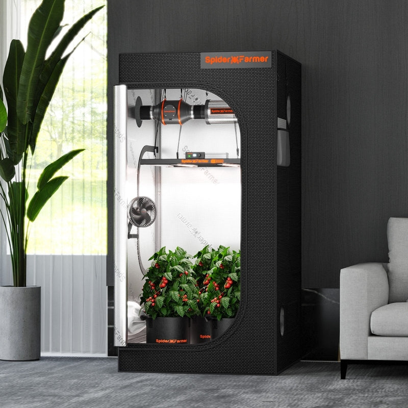 Spider Farmer® 3’x3’x6′ Grow Tent Spider Farmer indoor gardening system in a room with a plant and sofa.