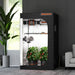 Spider Farmer® 4’x4’x6.5′ Grow Tent Small indoor grow tent with plants inside, placed in a room with a window and furniture.