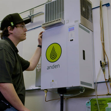 Person interacting with Anden AS150 Steam Humidifier – 1,200 Pints/Day Output, Ductless Installation in a technical setting