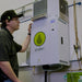 Person interacting with Anden AS150 Steam Humidifier – 1,200 Pints/Day Output, Ductless Installation in a technical setting
