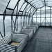 Grandio Summit Greenhouse side view with planters in snowy conditions 