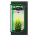 Vivosun 2x2 Smart Grow Tent Kit – 100W LumaLight & GrowHub E42A+ with a black textured exterior, green trim, a clear door, and a bright grow light inside illuminating a small green plant in a black pot.