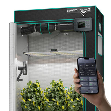 A Mars Hydro FC4000 320W 2x4 Smart Grow Tent Kit with iControl with reflective silver walls, black and teal trim, a top-mounted fan, grow light, and a digital control panel. A hand holds a smartphone showing the connected mobile app interface in front of the tent.