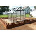 Grandio Ascent Greenhouse within wooded fence on earth backyard view 