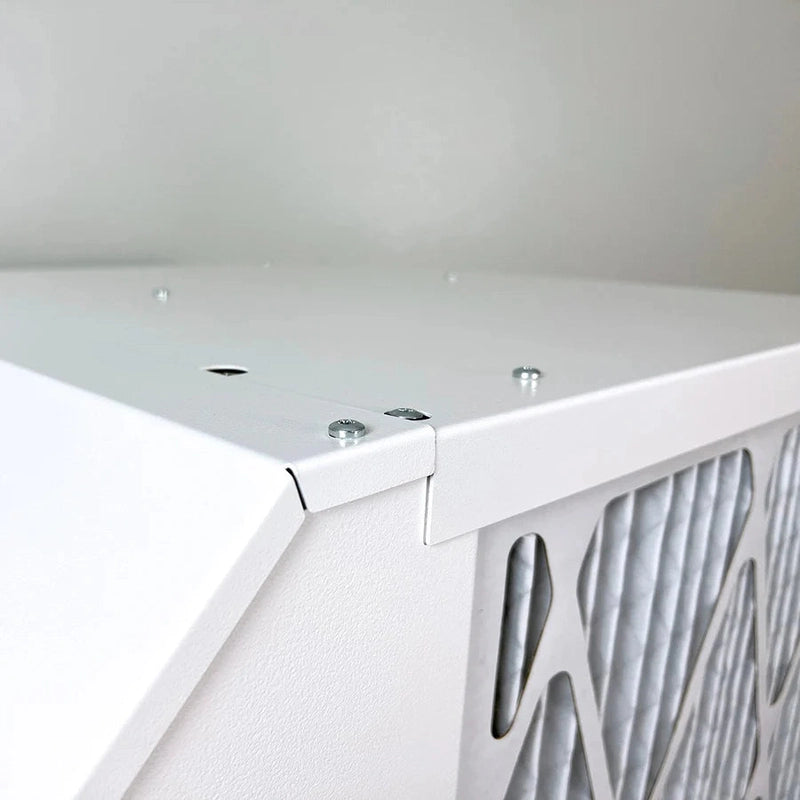 Quest 225 208/230V Dehumidifier Close-up of a white air filter with metallic grille on a light gray background