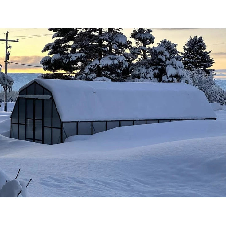 Grandio Summit Greenhouse Snow-covered  in the background during sunset
